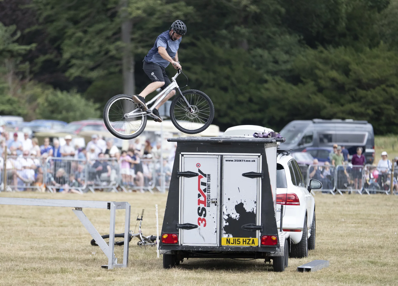 3SIXTY rider jumping over the branded trailer and portable equipment