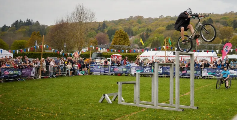 3SIXTY rider performing high above a large outdoor event crowd